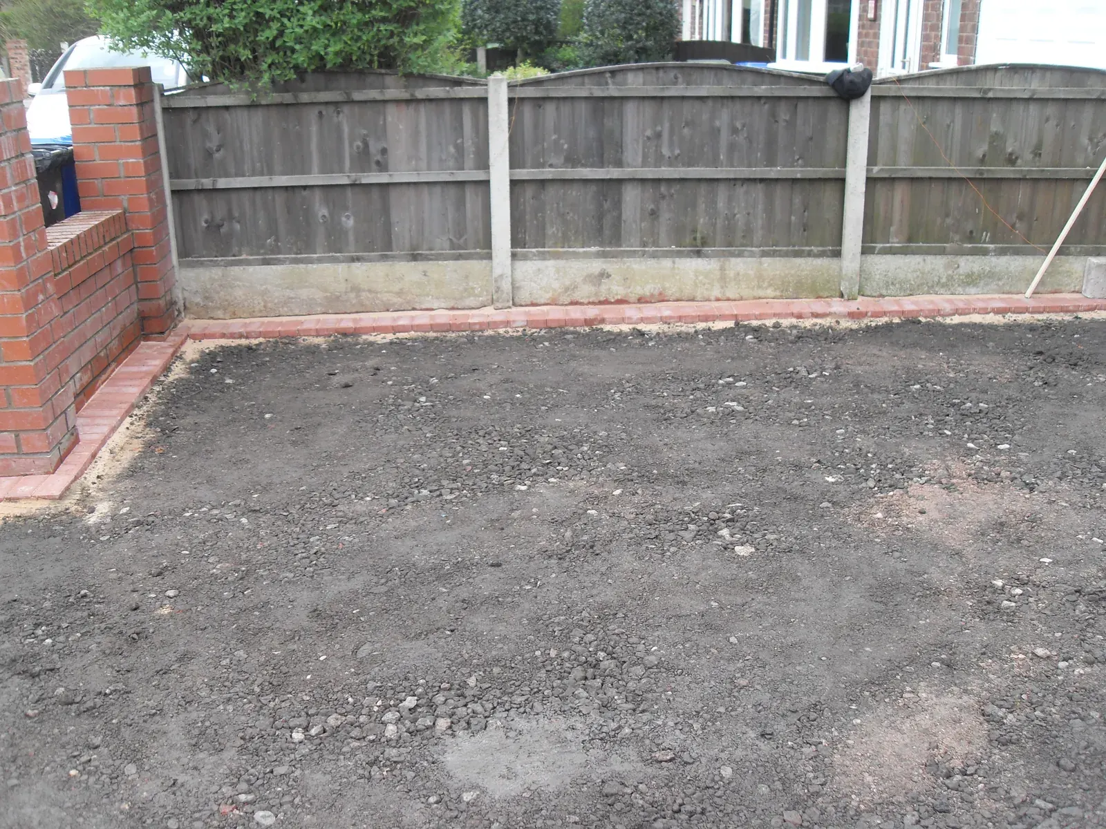 Compacted sub base prepared for a new driveway surface