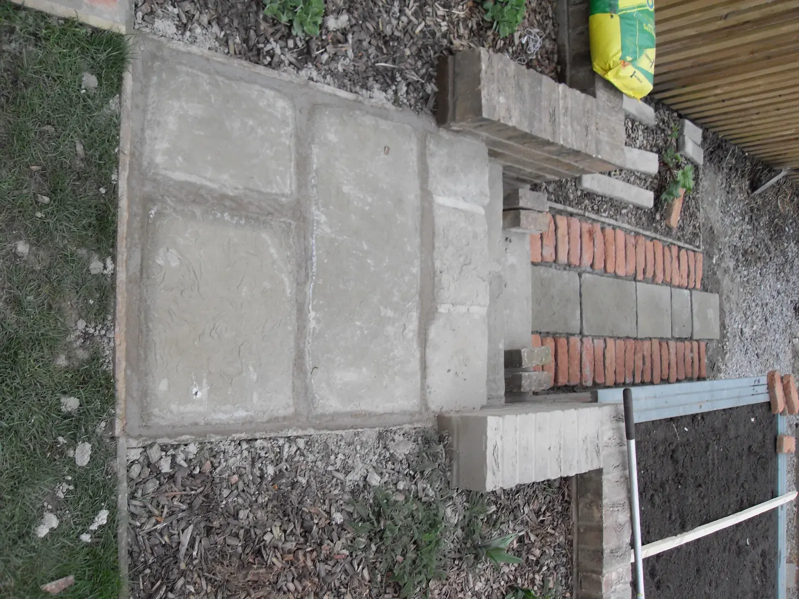 Concrete base finished with brick edging detail