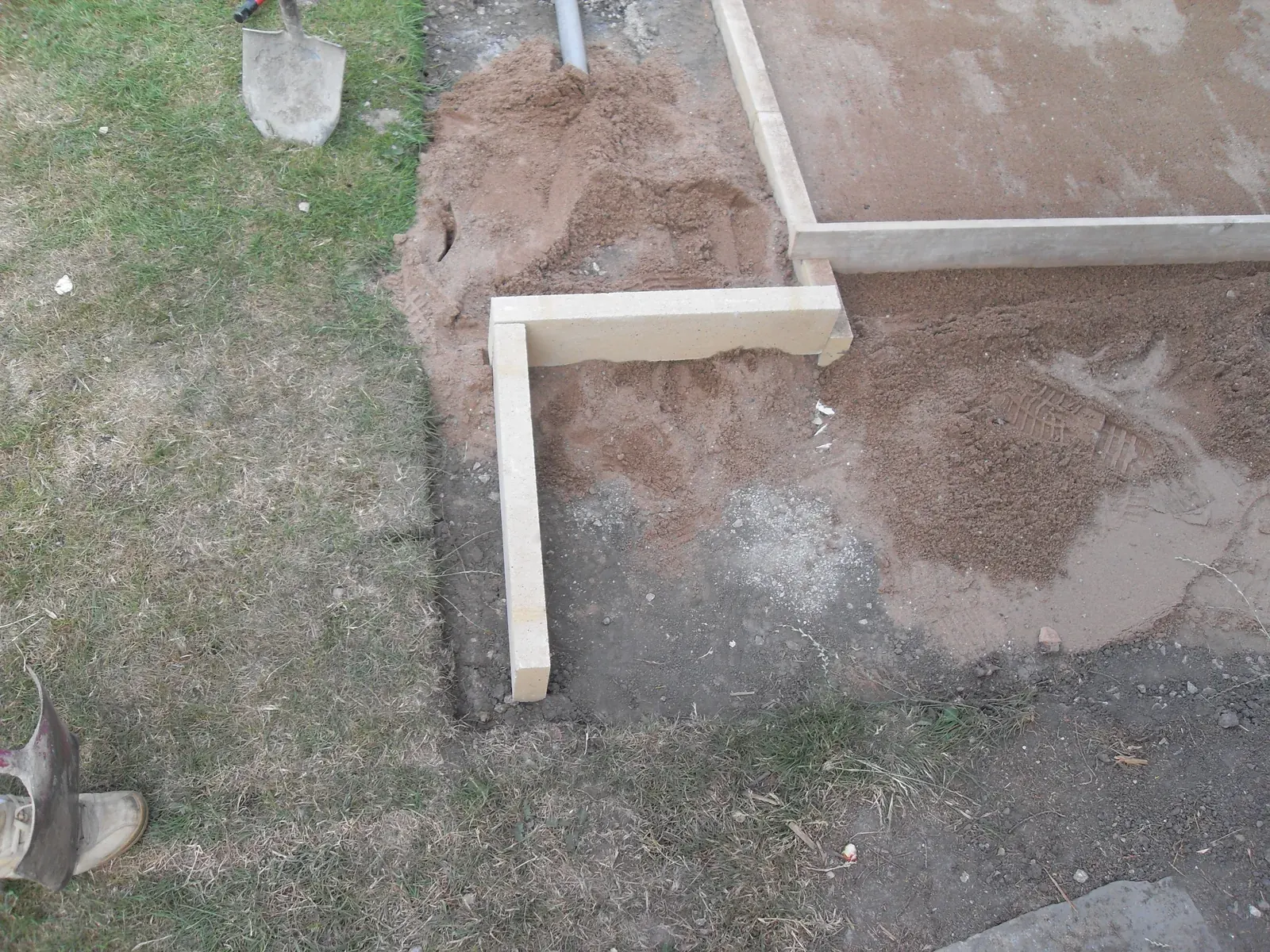Concrete sub base poured with timber edging set to level