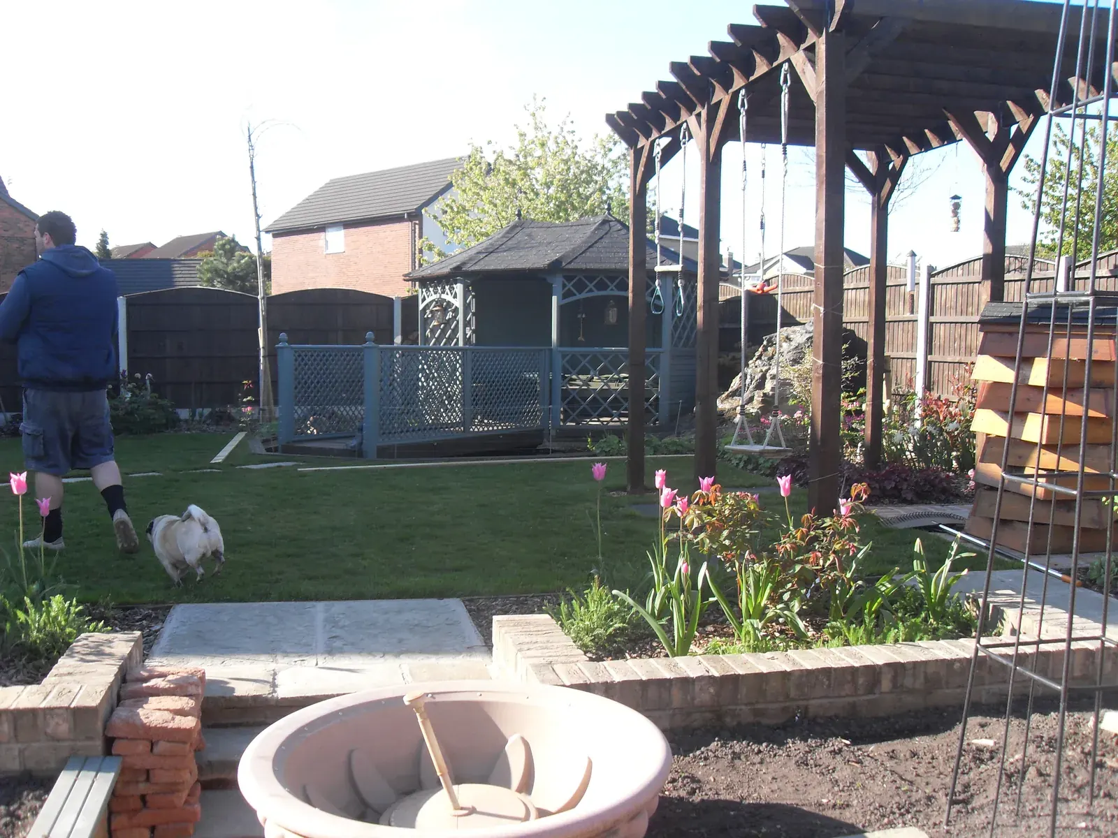 Landscaped garden with fire pit, pergola and new paving