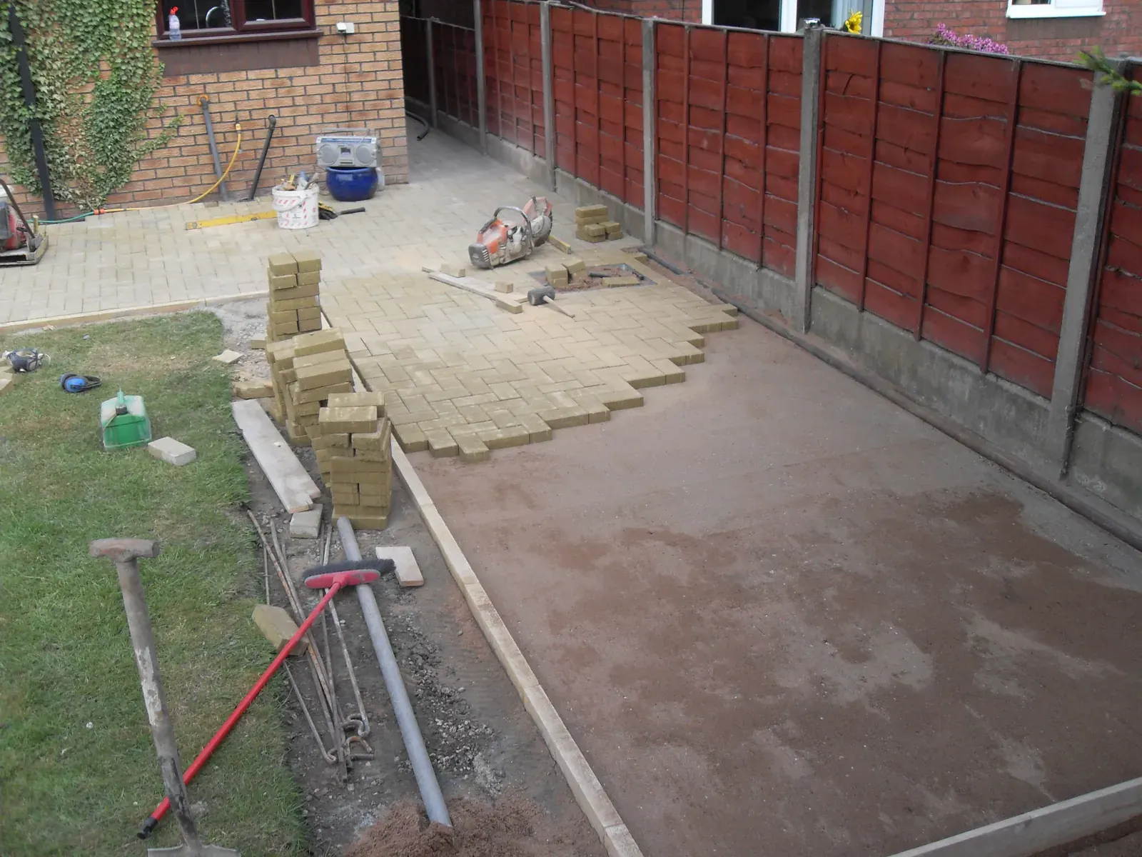 Patio paving being bedded onto a sand and mortar base