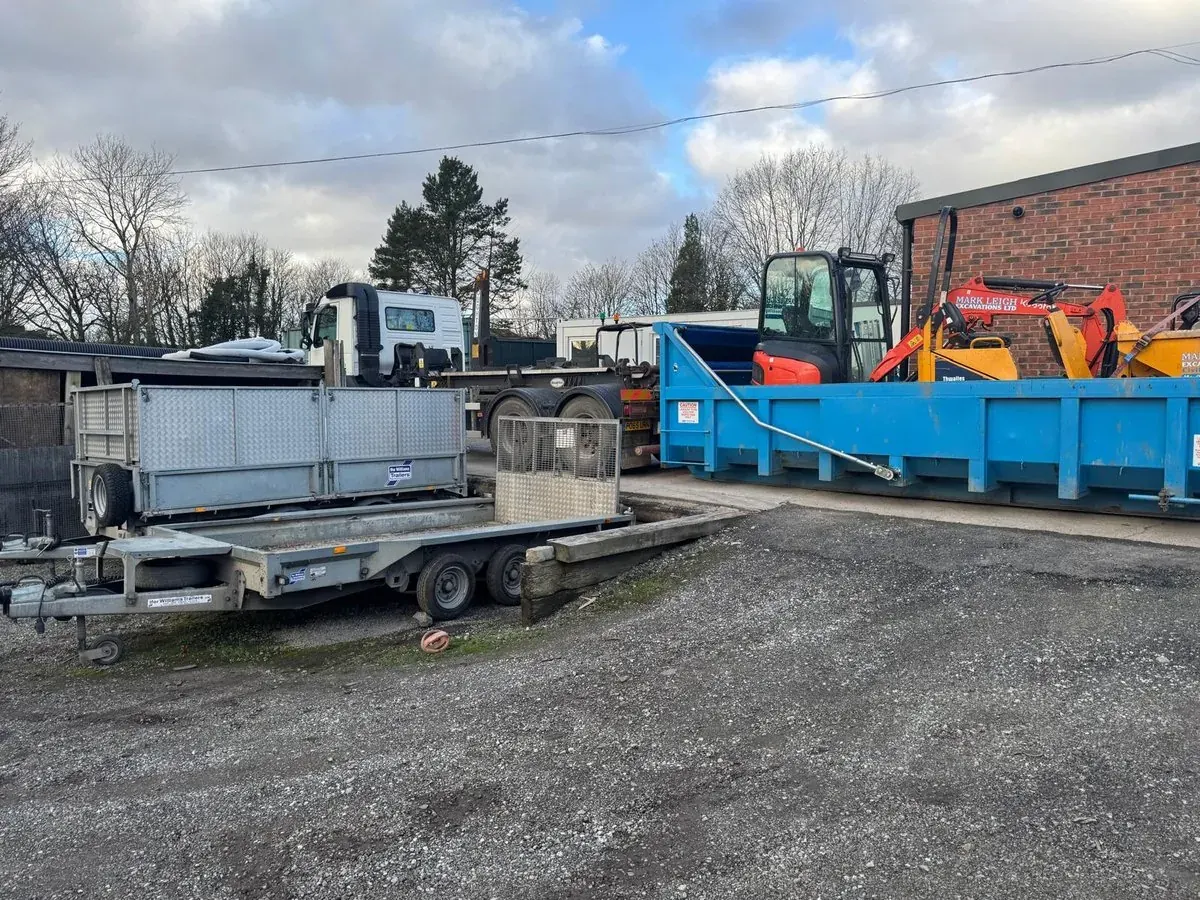 Plant trailer, skips and excavators lined up at the Gorton yard