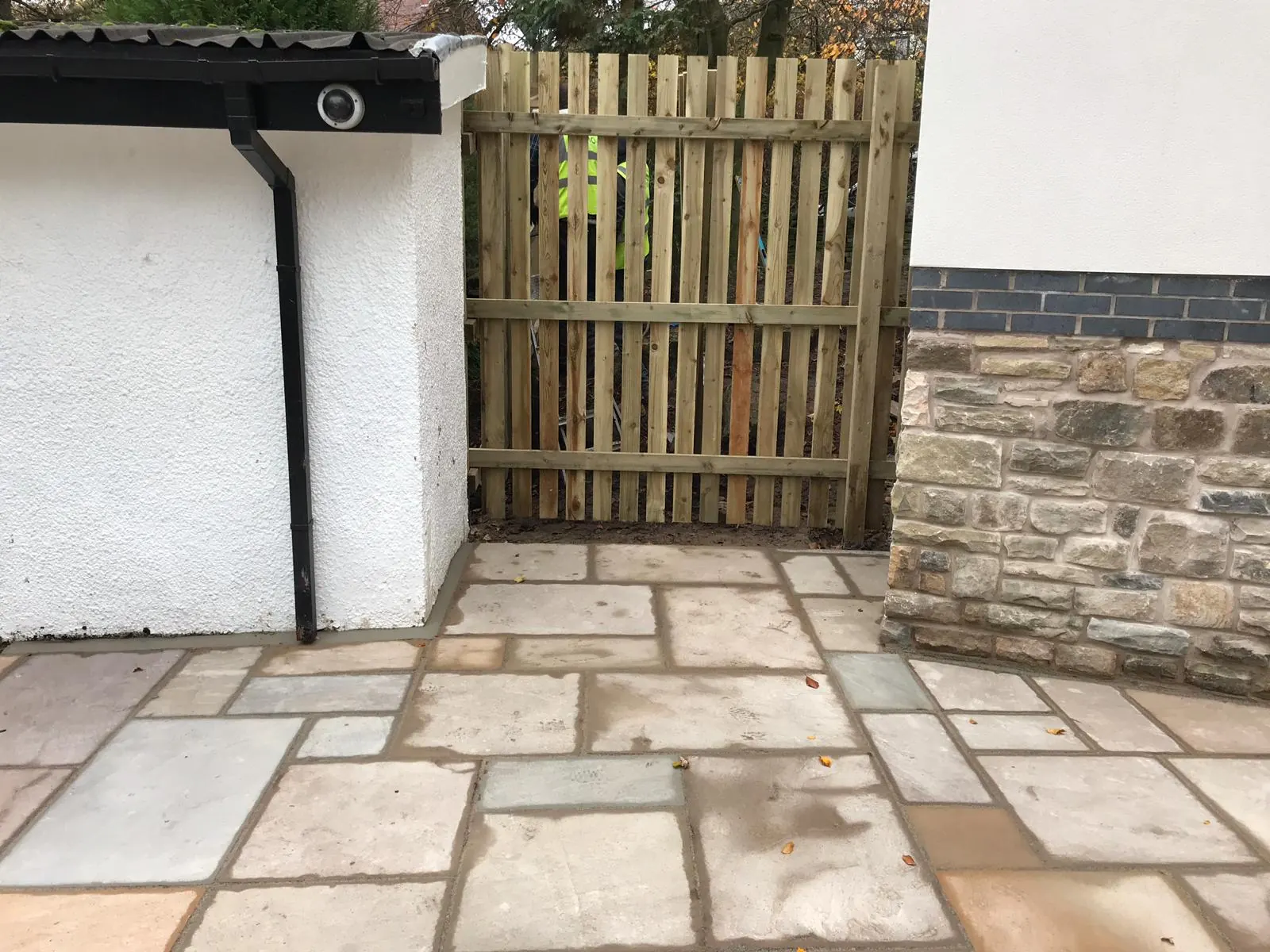 Sandstone patio finished up to a new timber side gate